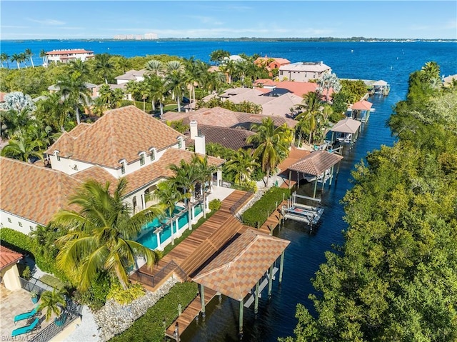 birds eye view of property featuring a water view