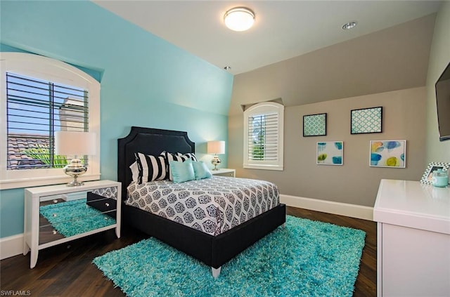 bedroom with dark wood-type flooring and vaulted ceiling