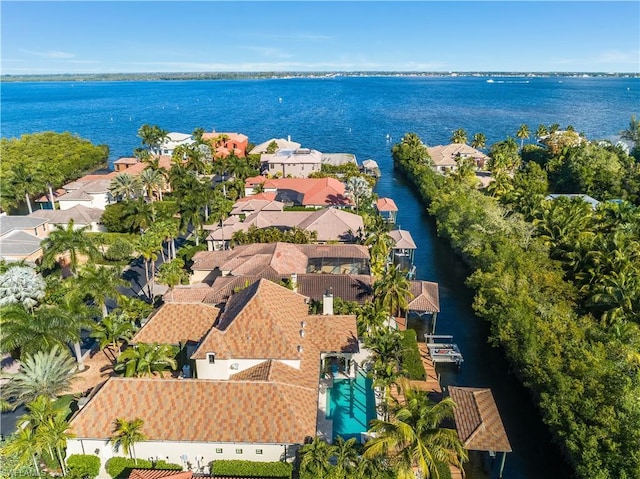 birds eye view of property featuring a water view