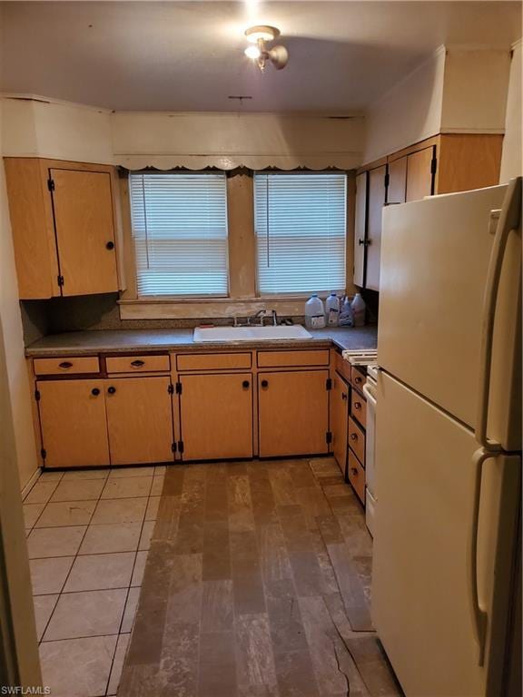 kitchen with white appliances and sink