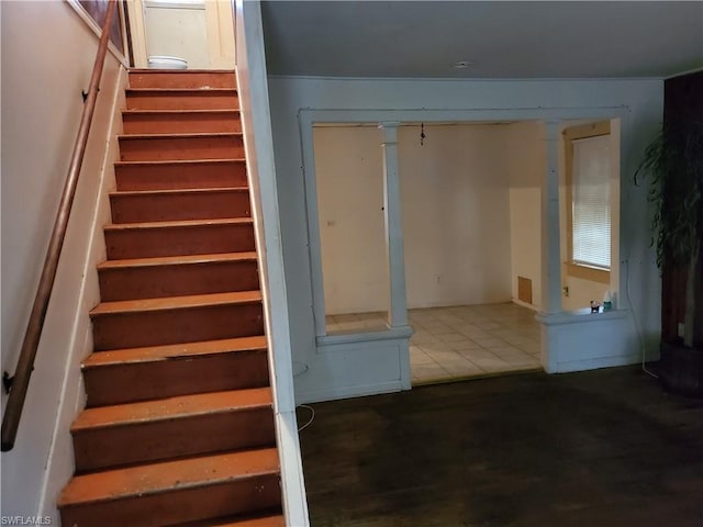 stairs featuring hardwood / wood-style floors