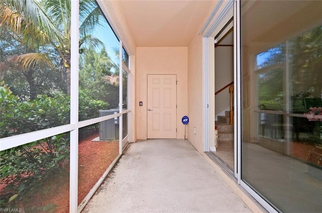 unfurnished sunroom with a wealth of natural light