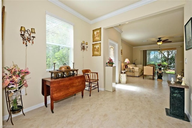 living area with light tile floors, plenty of natural light, crown molding, and ceiling fan