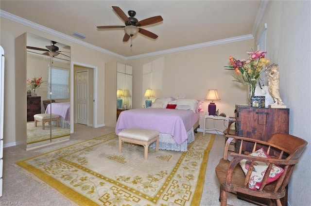 bedroom with light colored carpet, a closet, ornamental molding, and ceiling fan