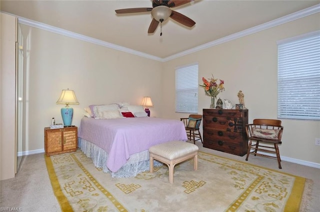 carpeted bedroom with ornamental molding and ceiling fan