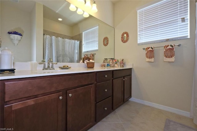 bathroom featuring tile floors and vanity