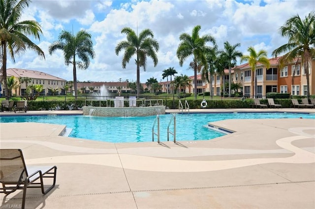 view of swimming pool featuring pool water feature