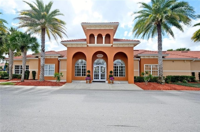 mediterranean / spanish house featuring french doors