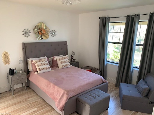 bedroom with light hardwood / wood-style flooring