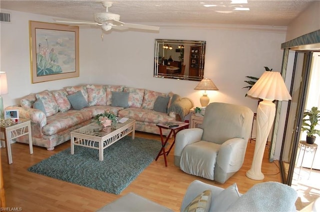 living room featuring ceiling fan and light wood-type flooring