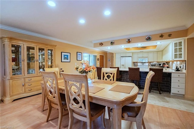 tiled dining room with ornamental molding