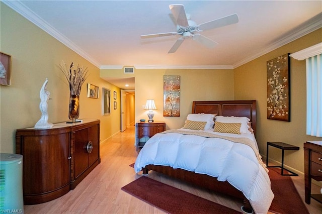 bedroom featuring ornamental molding, ceiling fan, and light wood-type flooring