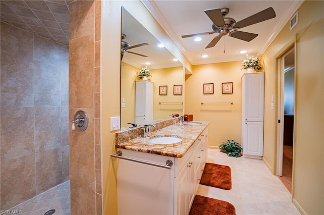 bathroom featuring a tile shower, tile floors, and ceiling fan