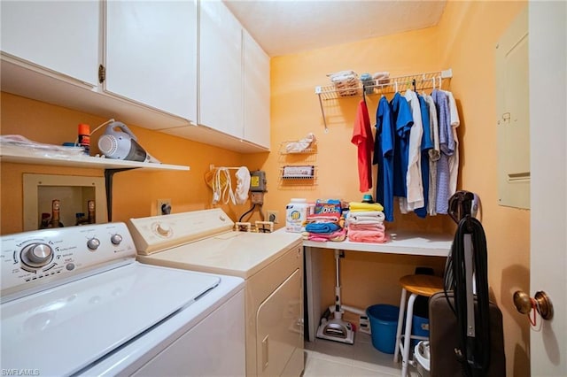 washroom with electric dryer hookup, light tile floors, cabinets, hookup for a washing machine, and washer and clothes dryer