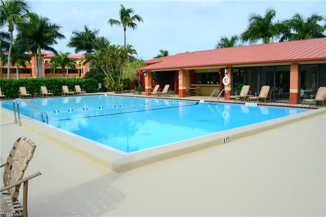 view of swimming pool with a patio area