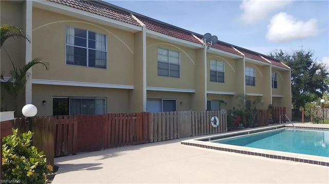 view of swimming pool featuring a patio area