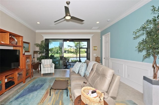 living room with ornamental molding, ceiling fan, and light tile floors