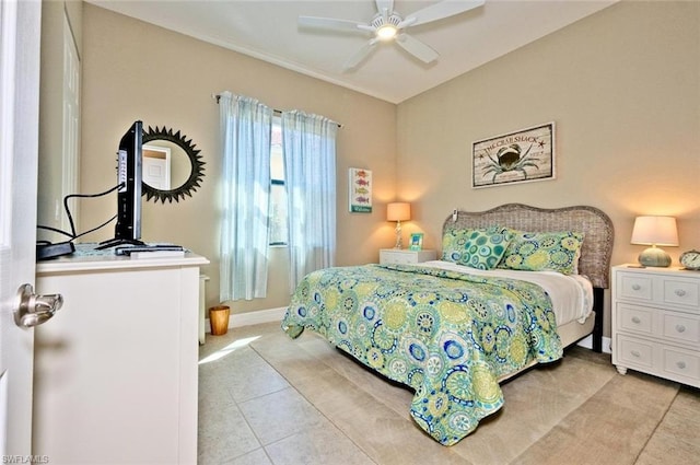 bedroom with ceiling fan and light tile floors