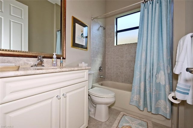 full bathroom featuring vanity, tile flooring, shower / bath combo with shower curtain, and toilet