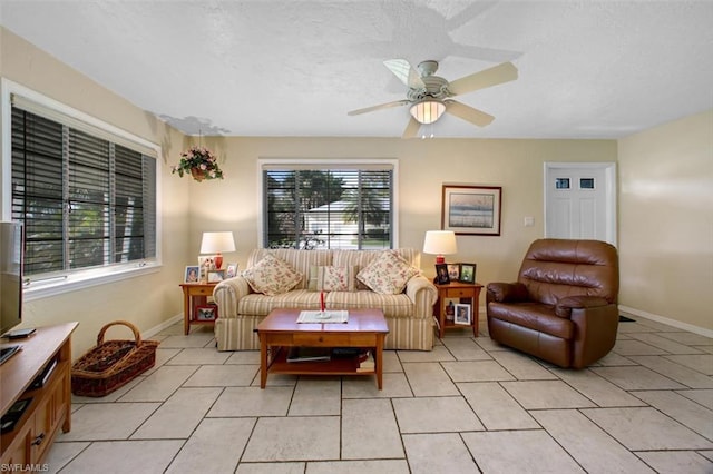 tiled living room with ceiling fan