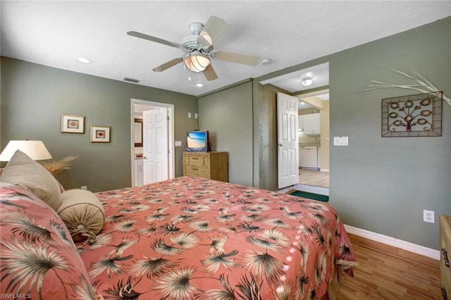 bedroom with connected bathroom, ceiling fan, and light wood-type flooring