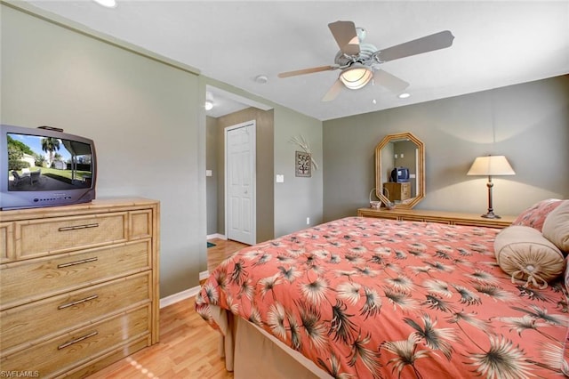 bedroom featuring ceiling fan and light hardwood / wood-style flooring