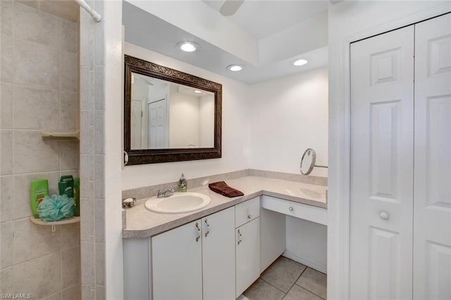 bathroom with tile flooring and vanity