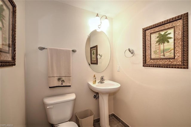 bathroom with tile floors and toilet