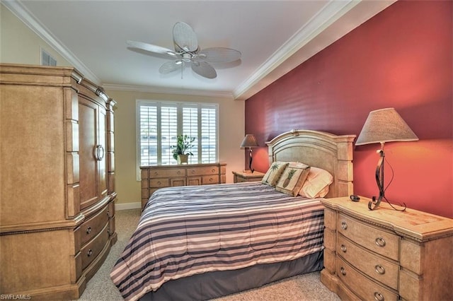 bedroom with light colored carpet, ceiling fan, and crown molding