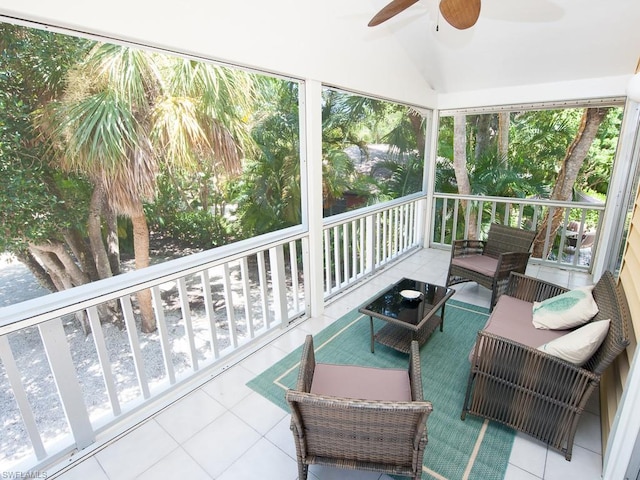 sunroom with lofted ceiling and ceiling fan