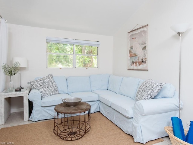 living room featuring light tile floors