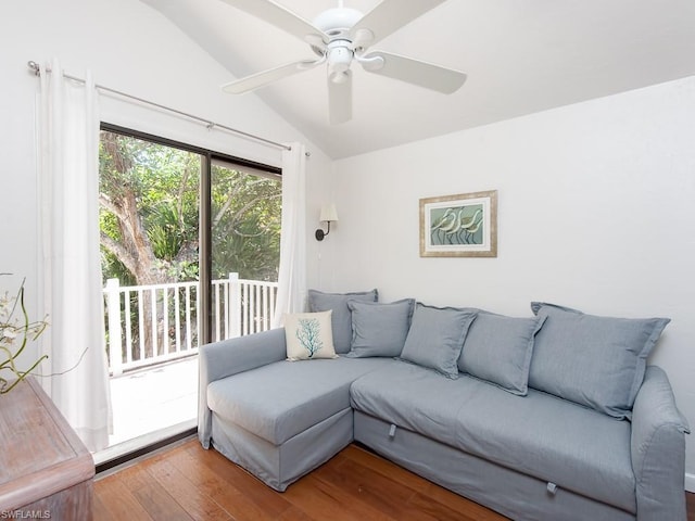 living room featuring wood-type flooring, ceiling fan, and lofted ceiling