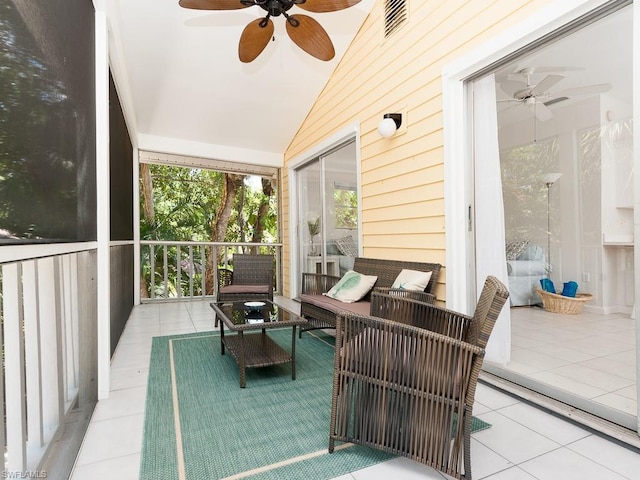 sunroom with lofted ceiling and ceiling fan