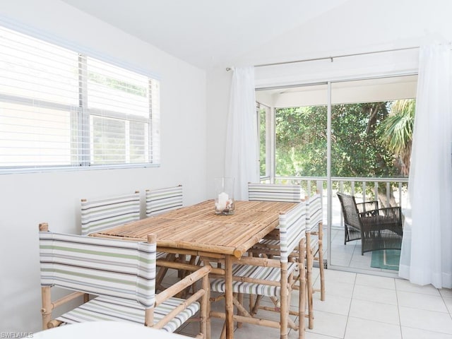 dining room featuring plenty of natural light and light tile floors