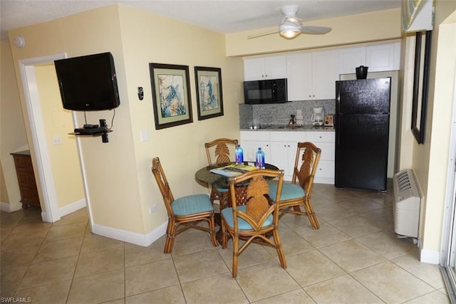 interior space featuring ceiling fan and light tile floors