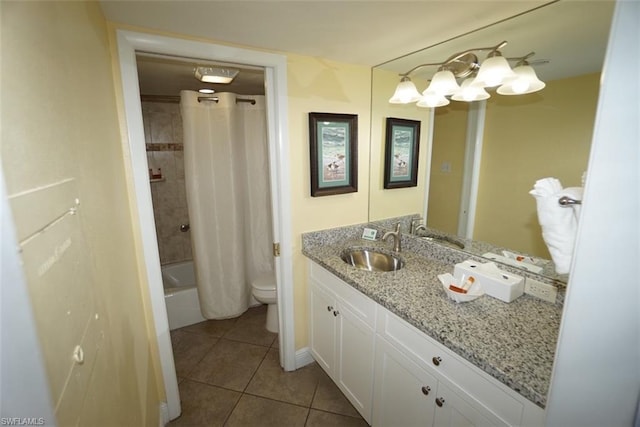 full bathroom featuring shower / bath combo with shower curtain, toilet, vanity with extensive cabinet space, and tile floors