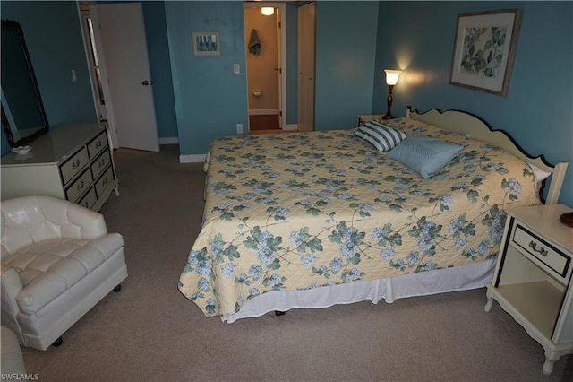 carpeted bedroom with ensuite bath