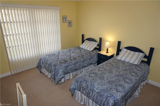 bedroom featuring light colored carpet