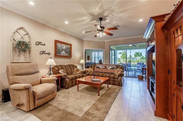 living room featuring light tile floors, crown molding, and ceiling fan