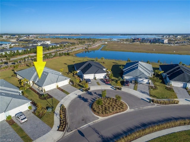 birds eye view of property with a water view