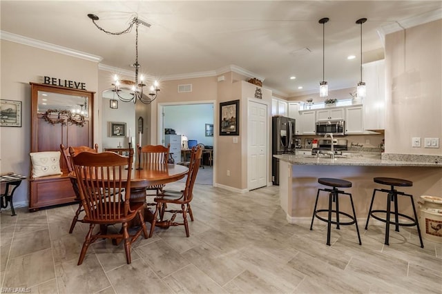 tiled dining area with ornamental molding and an inviting chandelier