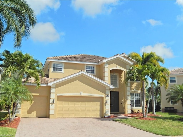 mediterranean / spanish-style home featuring a garage