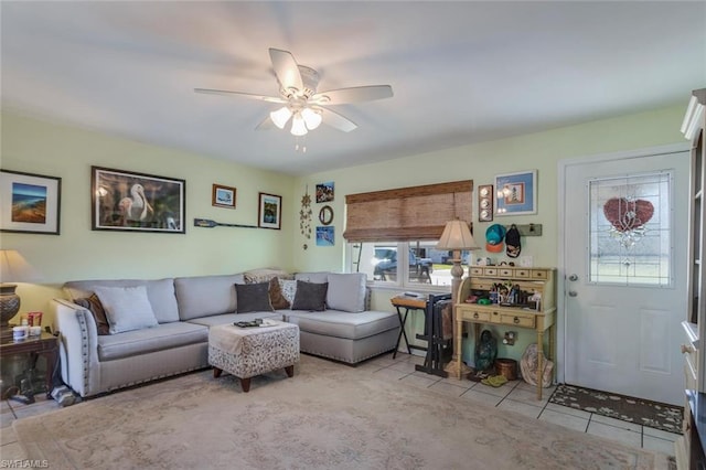 tiled living room with ceiling fan