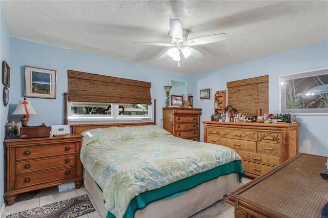 bedroom with light tile flooring and ceiling fan