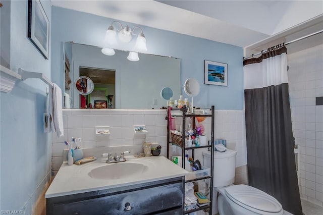 bathroom featuring backsplash, tile walls, toilet, and vanity