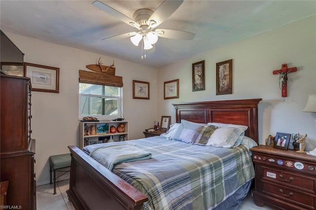 bedroom featuring ceiling fan and light tile floors