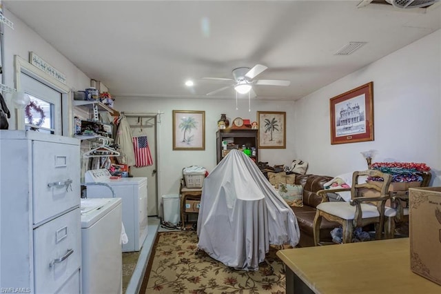 bedroom with separate washer and dryer and ceiling fan