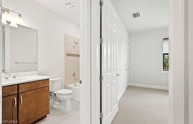 full bathroom featuring toilet, vanity, and bathtub / shower combination