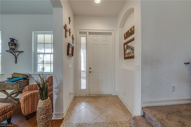 foyer entrance featuring light tile flooring