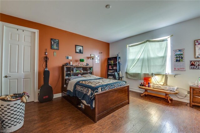 bedroom featuring dark hardwood / wood-style flooring